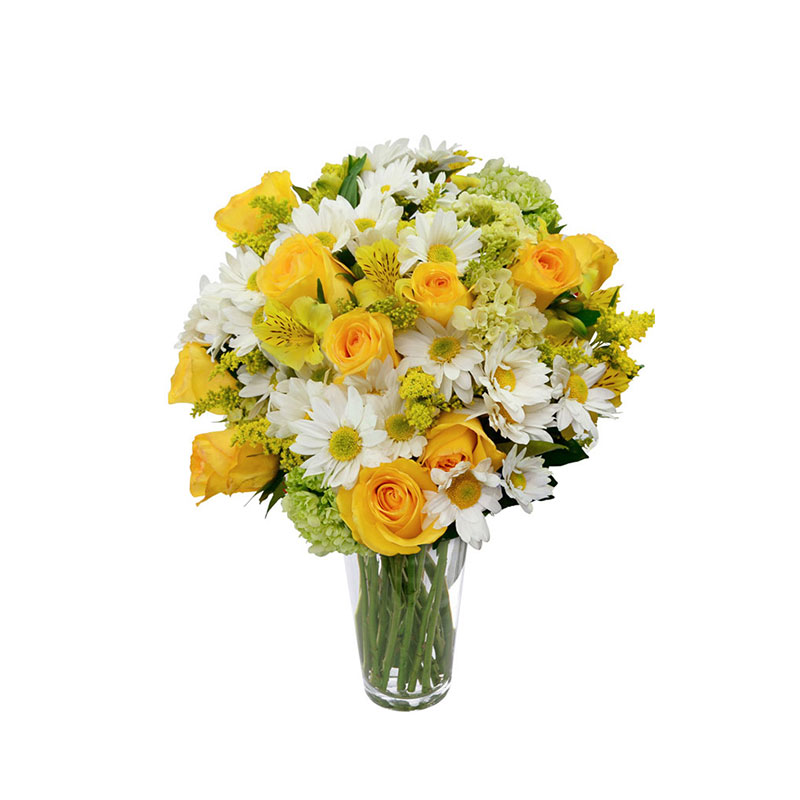 Jarrón de Vidrio con flores en tonalidades blanca amarillas